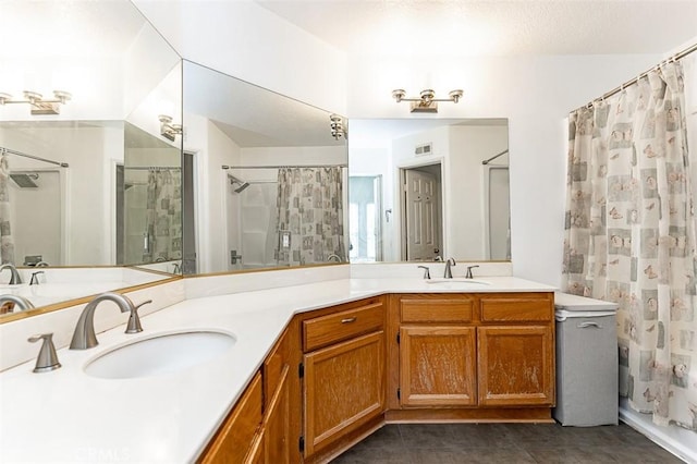 full bath with tile patterned floors, curtained shower, double vanity, and a sink