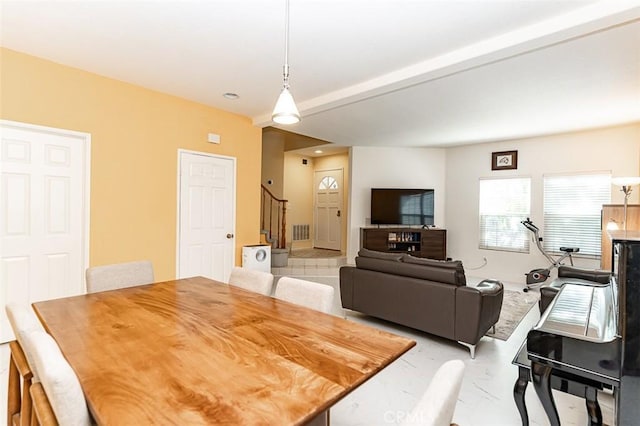 dining area featuring stairway and visible vents