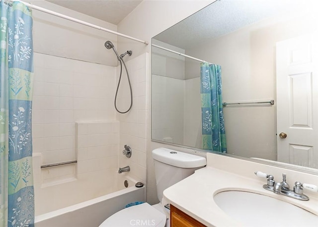 full bath with vanity, toilet, shower / bath combo, and a textured ceiling