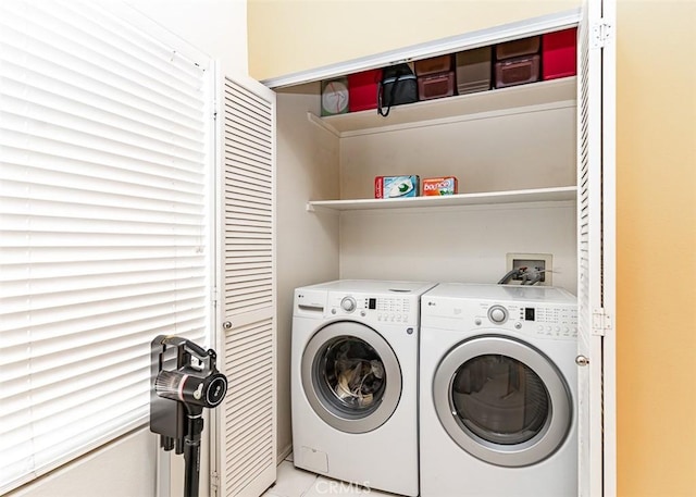 laundry area with laundry area and independent washer and dryer