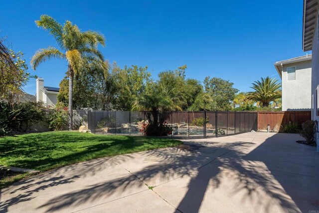 view of yard with a patio area and a fenced backyard