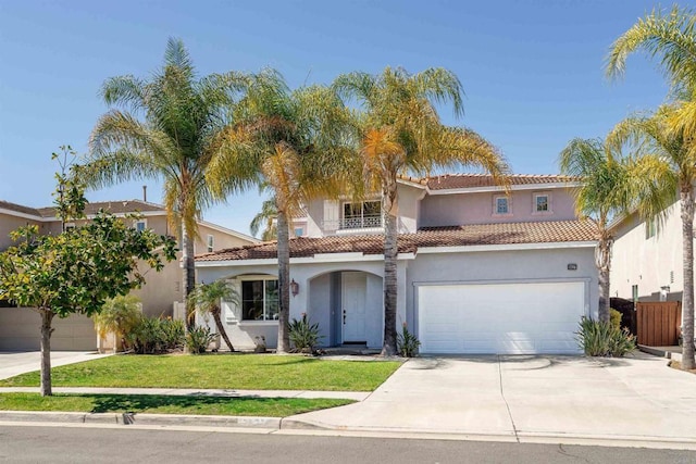 view of front of house featuring a balcony, driveway, stucco siding, a front lawn, and a garage