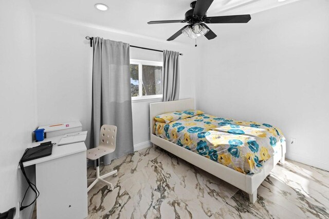 bedroom featuring recessed lighting, marble finish floor, a ceiling fan, and baseboards