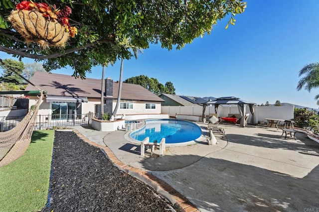 view of swimming pool with a patio, a fenced backyard, and a fenced in pool