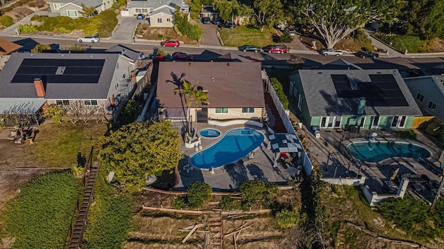 birds eye view of property with a residential view