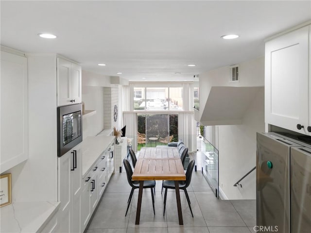 dining room featuring recessed lighting, visible vents, and light tile patterned flooring