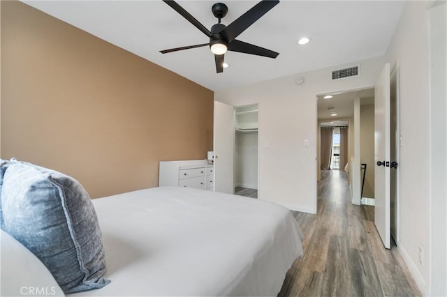 bedroom with visible vents, baseboards, recessed lighting, wood finished floors, and a ceiling fan