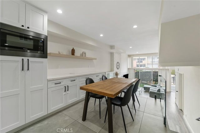 dining room featuring recessed lighting and light tile patterned flooring