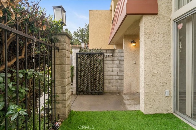 view of gate with fence