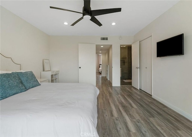 bedroom featuring visible vents, wood finished floors, recessed lighting, connected bathroom, and baseboards