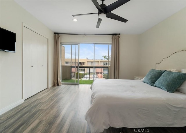 bedroom with a ceiling fan, wood finished floors, baseboards, recessed lighting, and access to exterior