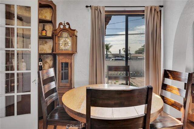 dining area featuring a textured wall