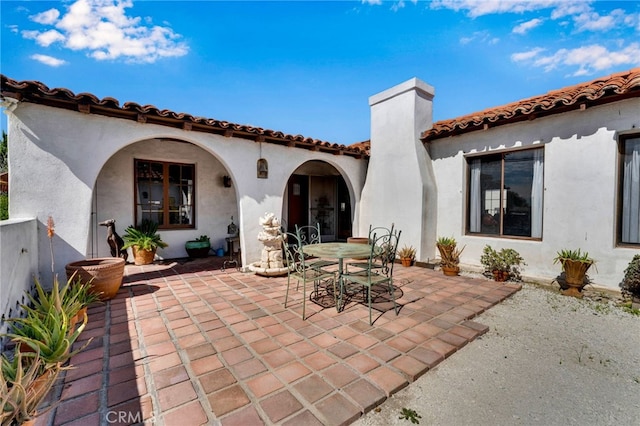 view of patio featuring outdoor dining area