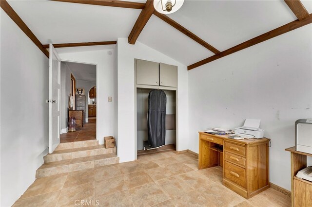 home office with arched walkways and vaulted ceiling with beams