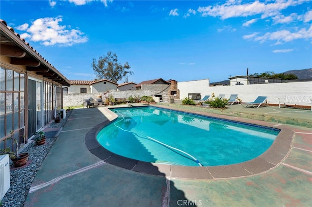 view of pool featuring a patio area, a fenced backyard, and a fenced in pool