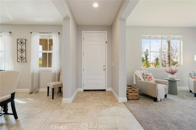 entryway featuring plenty of natural light, recessed lighting, and baseboards