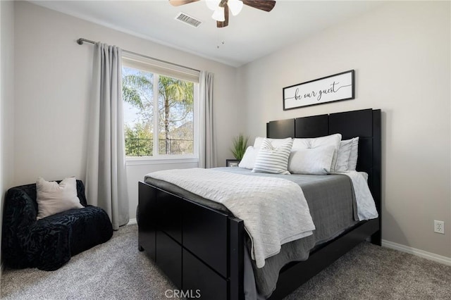 bedroom featuring visible vents, light carpet, baseboards, and a ceiling fan