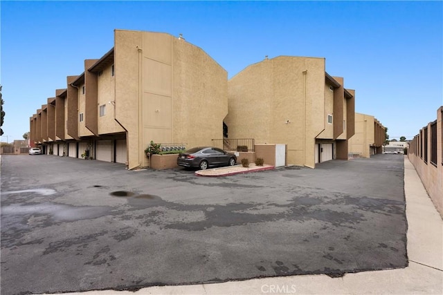 view of property with community garages