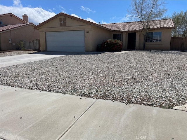 single story home featuring a tile roof, an attached garage, driveway, and stucco siding