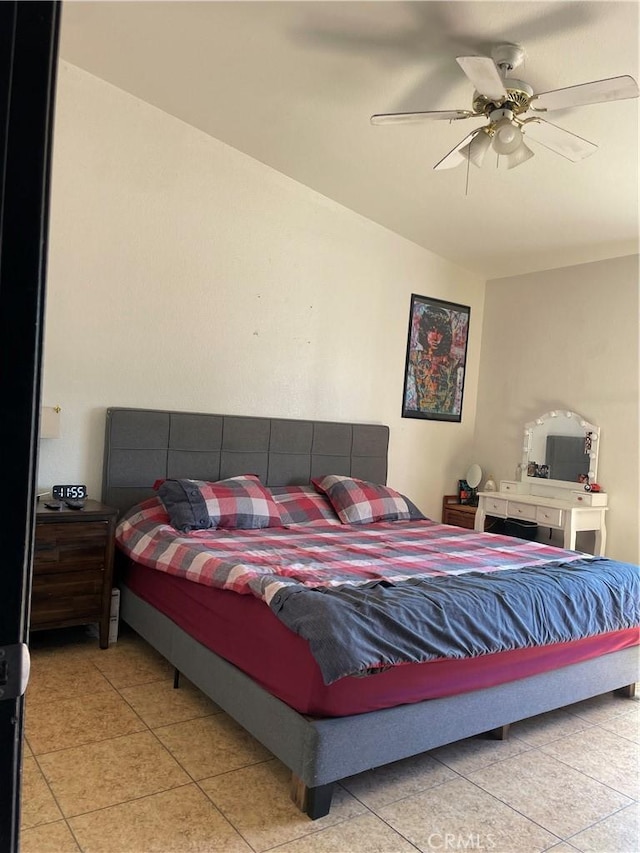 bedroom featuring light tile patterned floors and a ceiling fan