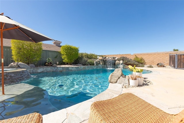 view of pool with fence and a fenced in pool