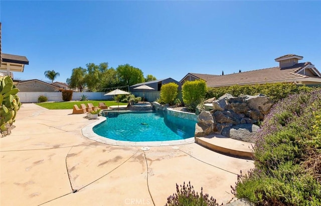 view of swimming pool with a patio area, a fenced backyard, and a fenced in pool