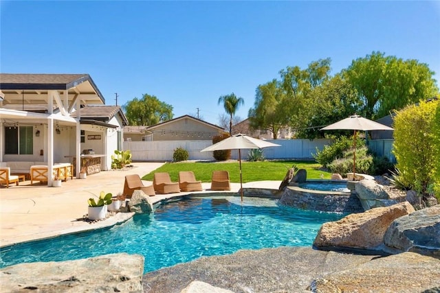 view of swimming pool featuring a fenced in pool, a yard, a fenced backyard, an in ground hot tub, and a patio