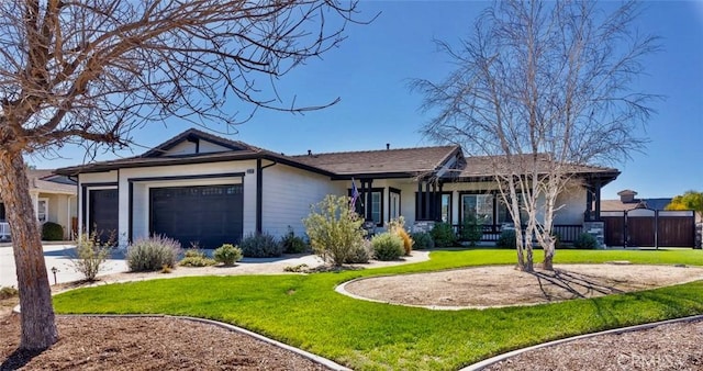 ranch-style home featuring a garage and a front lawn