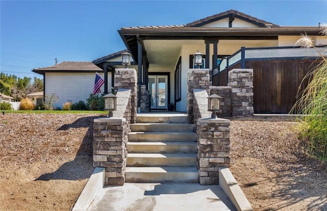 view of front of home featuring a porch and french doors