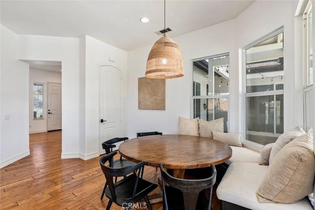 dining area with light wood-style flooring, recessed lighting, baseboards, and visible vents