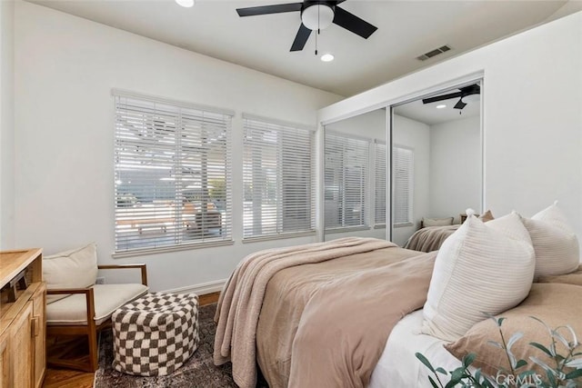 bedroom featuring visible vents, a ceiling fan, wood finished floors, recessed lighting, and a closet