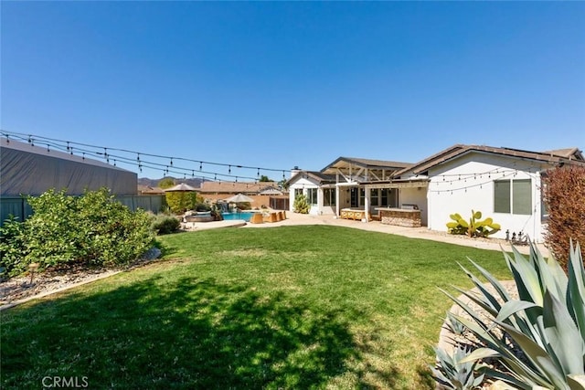 view of yard featuring a patio and a fenced backyard