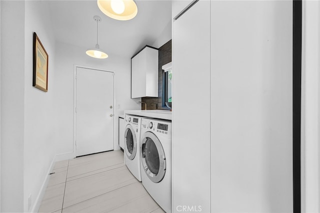32252 Azores Rd, Dana Point, CA 92629 - laundry room with washing machine and clothes dryer, baseboards, and cabinet space