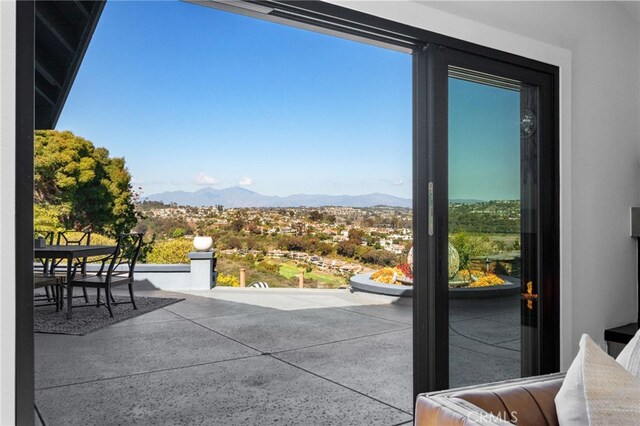 view of patio / terrace featuring a mountain view and outdoor dining space