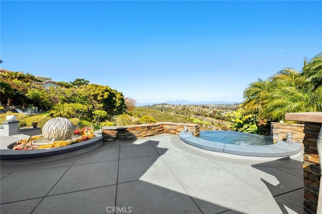 view of patio with a mountain view