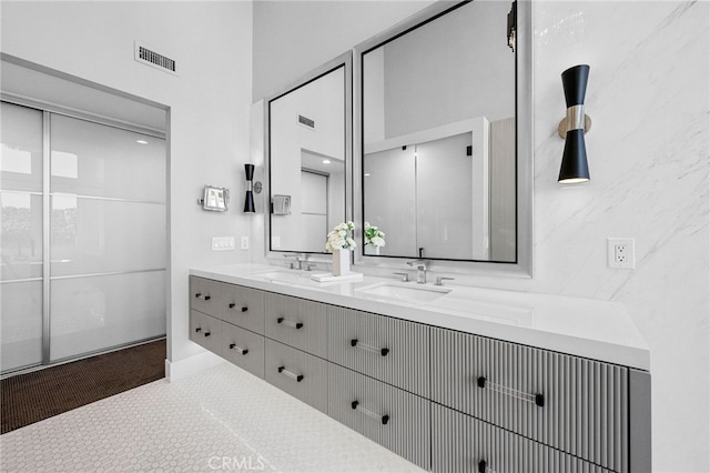 32252 Azores Rd, Dana Point, CA 92629 - bathroom featuring visible vents, a sink, baseboards, and double vanity