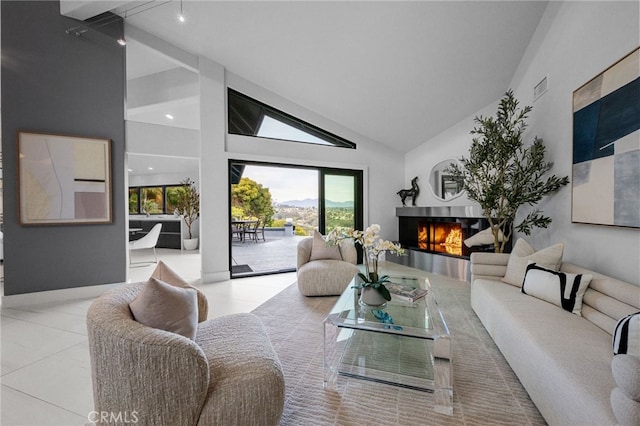 32252 Azores Rd, Dana Point, CA 92629 - living room with high vaulted ceiling, a lit fireplace, tile patterned floors, and visible vents