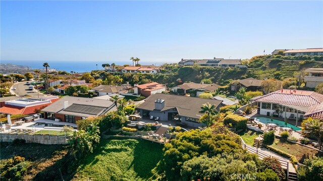 birds eye view of property with a residential view and a water view