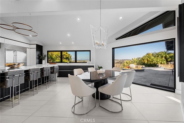 dining space with an inviting chandelier, light tile patterned floors, and a wealth of natural light