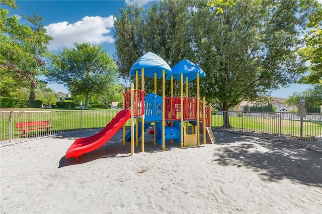 communal playground featuring fence