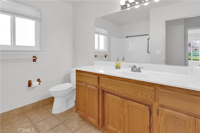 full bathroom with toilet, a healthy amount of sunlight, a shower, and vanity