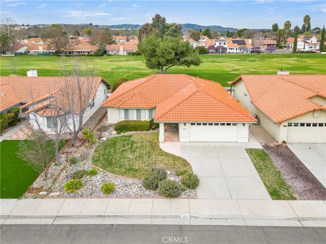 birds eye view of property with a residential view