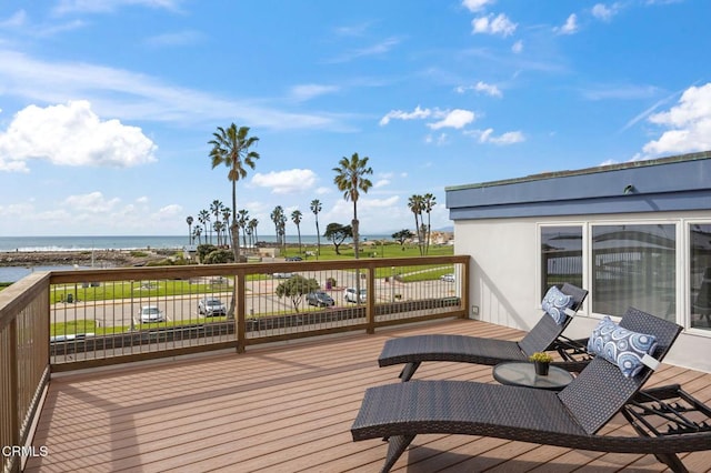 wooden deck with a water view