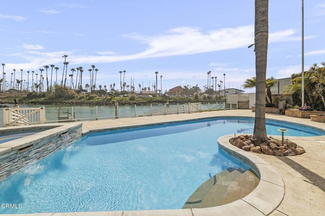 outdoor pool featuring fence