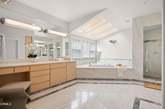 bathroom with vanity, lofted ceiling, a stall shower, a bath, and marble finish floor