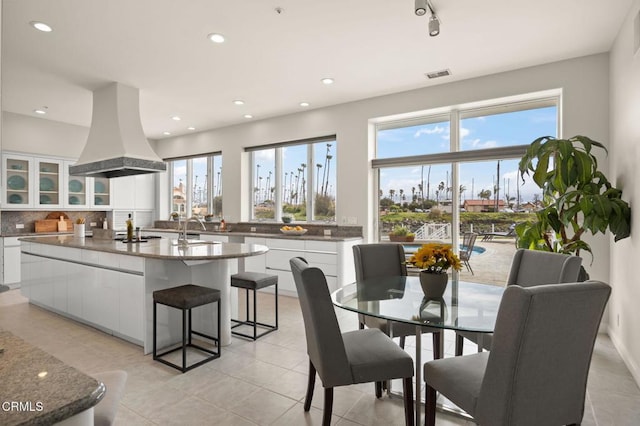 dining space with a wealth of natural light, visible vents, and recessed lighting