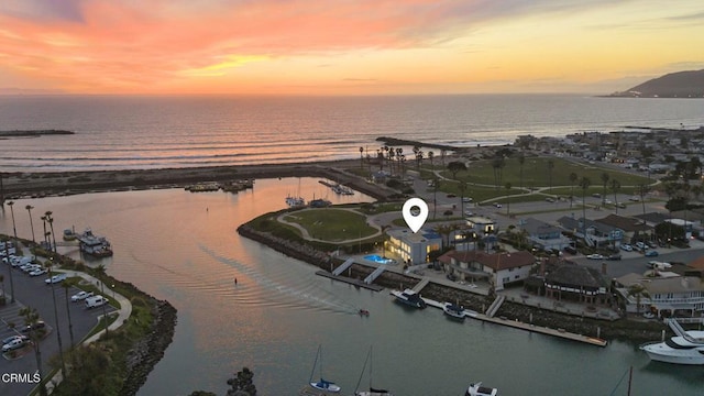 birds eye view of property featuring a water view