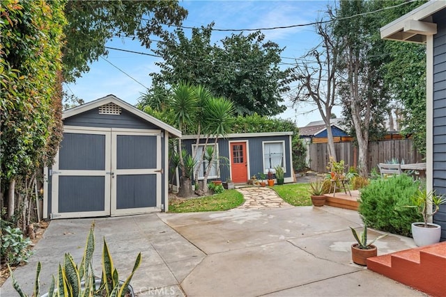 view of shed with fence