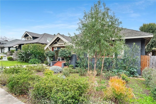 view of front of house featuring fence