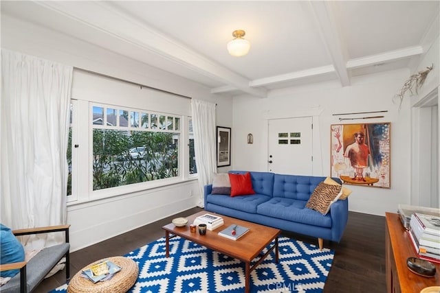 living room featuring beamed ceiling and wood finished floors